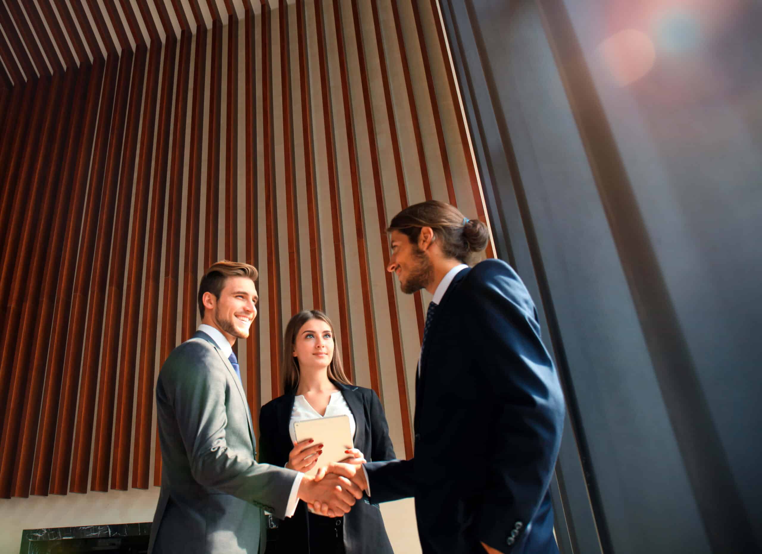 business people shaking hands finishing up meeting